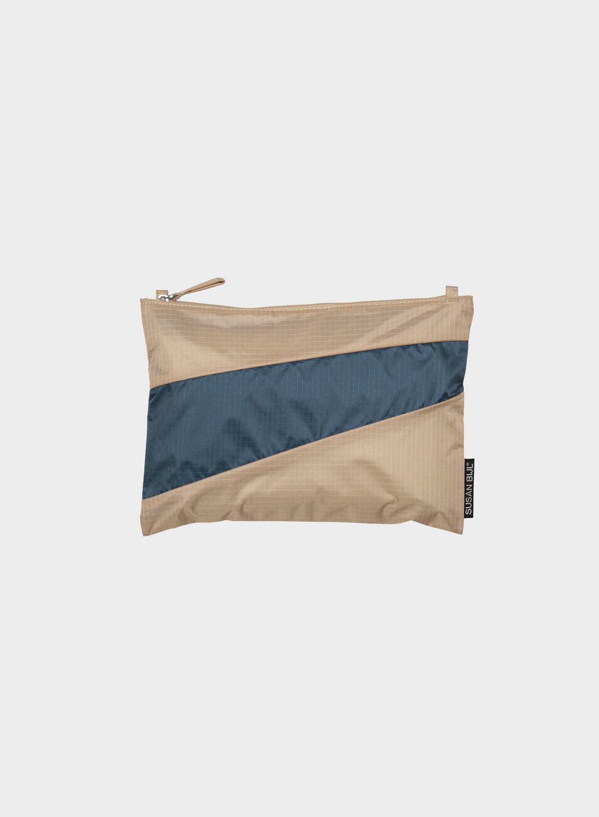A small zippered pouch with a diagonal color-block design in beige and slate blue, shown against a light gray background.